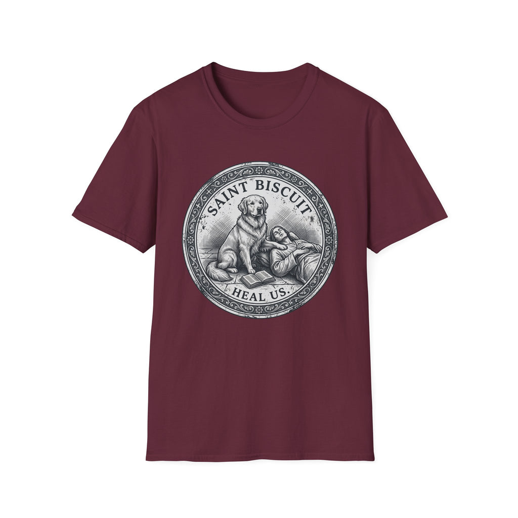 Saint Biscuit Heal Us T-shirt flat lay in maroon, featuring a vintage-style medallion graphic of a golden retriever dog watching over a reclining figure with the text 'Saint Biscuit Heal Us'.