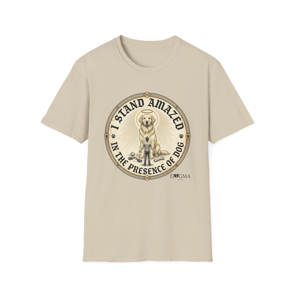 I Stand Amazed Golden Retriever T-Shirt flat lay in sand, featuring a circular vintage-style graphic of a golden retriever with a halo and the text "I Stand Amazed in the Presence of Dog" with Dogma House branding.