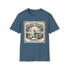 How Great Thou Bark Monotone T-Shirt flat lay on steel blue/indigo shirt featuring a vintage-style sepia graphic of a dog standing on a hilltop with divine rays of light and an open bible, with the text 'How Great Thou Bark – A Hymn for the Devoted.'