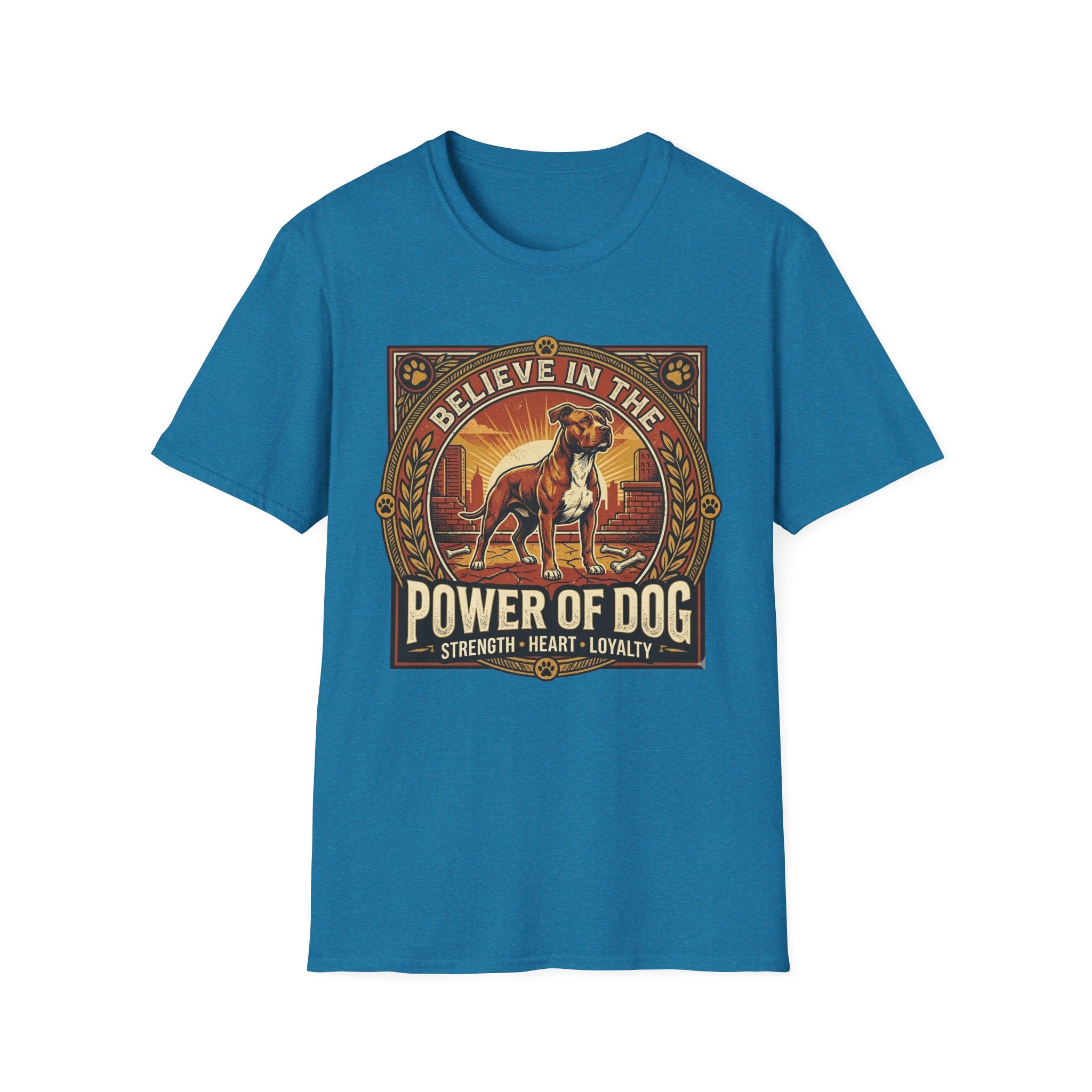 Believe in the Power of Dog Pitbull Cityscape T-Shirt in sapphire teal blue, flat lay, featuring a retro-style badge graphic of a muscular brown and white Pitbull standing proudly before a warm urban cityscape at sunset, with text reading Believe in the Power of Dog and Strength, Heart, Loyalty.