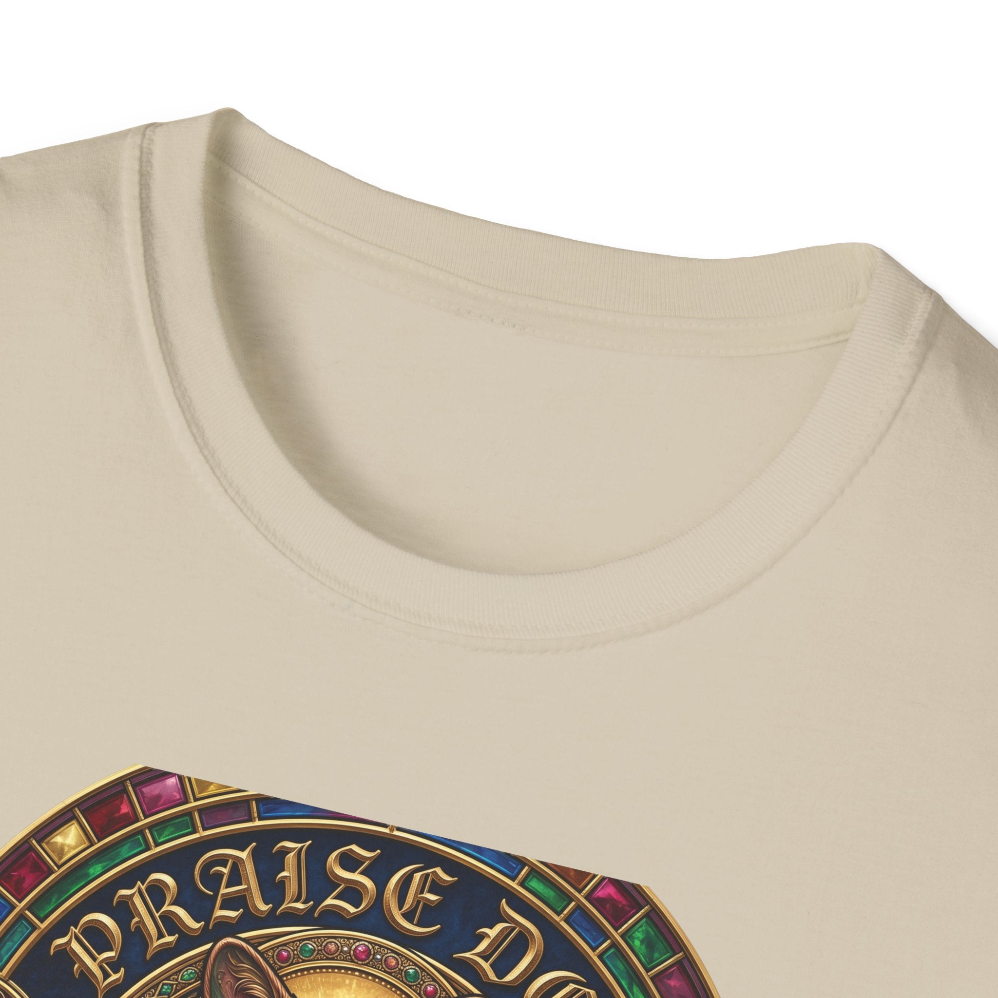 Praise Dog From Whom All Blessings Flow Corgi T-Shirt close-up detail of the collar area on a natural tan shirt, showing the jewel-encrusted border and gold gothic Praise Dog lettering.