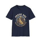 Praise Dog From Whom All Blessings Flow Labrador T-Shirt flat lay in navy blue, featuring a circular badge graphic of a golden Labrador gazing upward at a sunburst, surrounded by icons of a bone, tennis ball, paw print, and smiley face.
