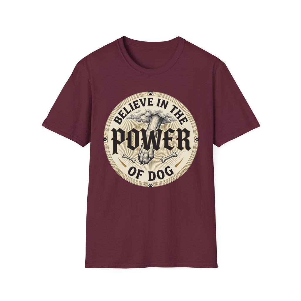 Believe in the Power of Dog Paw T-shirt flat lay in maroon, featuring a circular vintage badge graphic of a dog paw raised like a fist from clouds above crossed bones, with paw print accents and bold text.