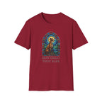 How Great Thou Bark Sight Hound T-shirt flat lay, cardinal red shirt featuring a stained-glass style arched window graphic of a seated sight hound dog with a halo and the text 'How Great Thou Bark.'