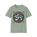 Believe in the Power of Dog Bernese T-Shirt in sage green, flat lay view showing a circular badge graphic with a halo-wearing Bernese Mountain Dog set against a mountain and forest landscape, with crossed bones and the words 'Loyalty Warmth Love'.