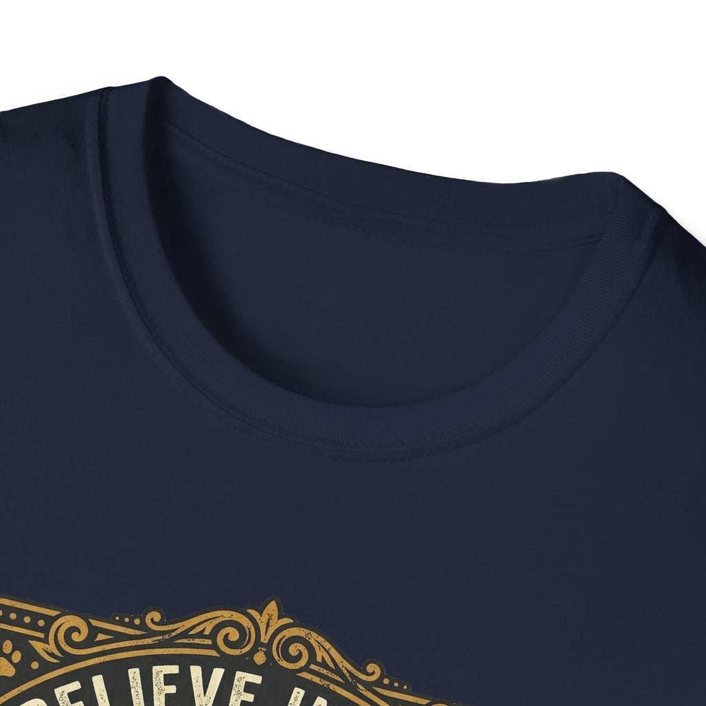 Believe in the Power of Dog T-shirt close-up detail on navy blue shirt showing the ornate gold border and 'Believe In The' text of the vintage badge graphic.