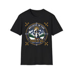 Believe in the Power of Dog Bernese T-Shirt in black, flat lay view showing a circular badge graphic with a halo-wearing Bernese Mountain Dog set against a mountain and forest landscape, with crossed bones and the words 'Loyalty Warmth Love'.