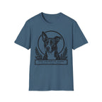 Holy Orders | Lobo T-Shirt flat lay on white shirt featuring a stained glass style illustration of Lobo, a black-coated dog with a white blaze and large upright ears, depicted as a holy figure with a golden halo and the text 'Holy Orders.'