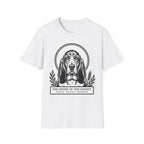 Holy Orders | Basset Hound T-Shirt detail view featuring a stained glass style illustration of a Basset Hound depicted as a holy figure with a golden halo and the text 'Holy Orders.'