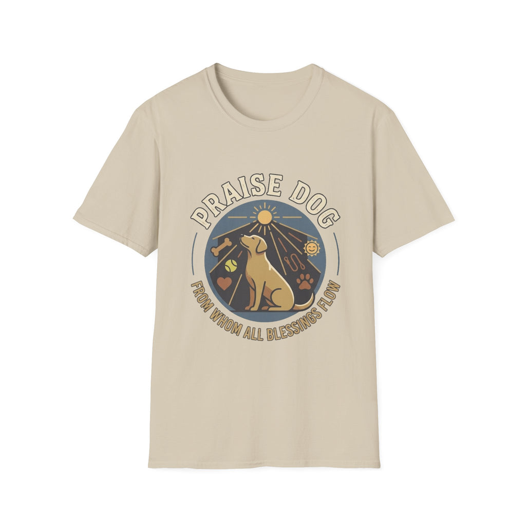 Praise Dog From Whom All Blessings Flow Labrador T-Shirt flat lay in natural tan, featuring a circular badge graphic of a golden Labrador gazing upward at a sunburst, surrounded by icons of a bone, tennis ball, paw print, and smiley face.