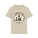 I Stand Amazed Pitbull T-Shirt in sand, flat lay front view showing a vintage-style circular graphic of a pitbull with a halo seated above a small human figure, with the text 'I Stand Amazed in the Presence of Dog.'