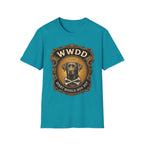 What Would Dog Do Chocolate Lab T-Shirt flat lay on teal, featuring an ornate gold WWDD badge with a halo-wearing chocolate Labrador and crossbones and the text 'What Would Dog Do?'