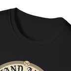 I Stand Amazed Pitbull T-Shirt in black, close-up of the neckline and upper graphic detail showing the circular pitbull design with crossed-bone medallion and vintage lettering.