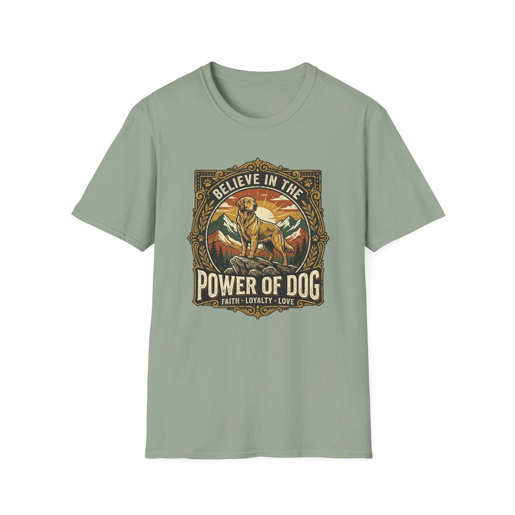 Believe in the Power of Dog T-shirt flat lay in sage green, featuring a vintage ornate badge graphic of a Labrador standing on a rocky mountain outcrop at sunset, with the text 'Believe in the Power of Dog' and 'Faith, Loyalty, Love'.