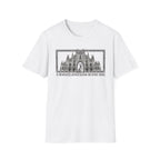 A Mighty Fortress is Our Dog T-Shirt flat lay in white featuring a detailed gothic cathedral illustration with a dog standing in the doorway, framed in an ornate border with text below.
