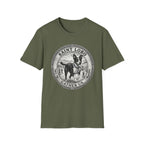 Saint Lobo Gather Us T-Shirt flat lay in military green, featuring a vintage medallion graphic of a leaping border collie-style dog with a halo, surrounded by the text 'Saint Lobo — Gather Us.'