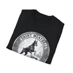 Saint Meatball Defend Us T-Shirt folded flat lay on black shirt showing the Doberman saint medallion design.