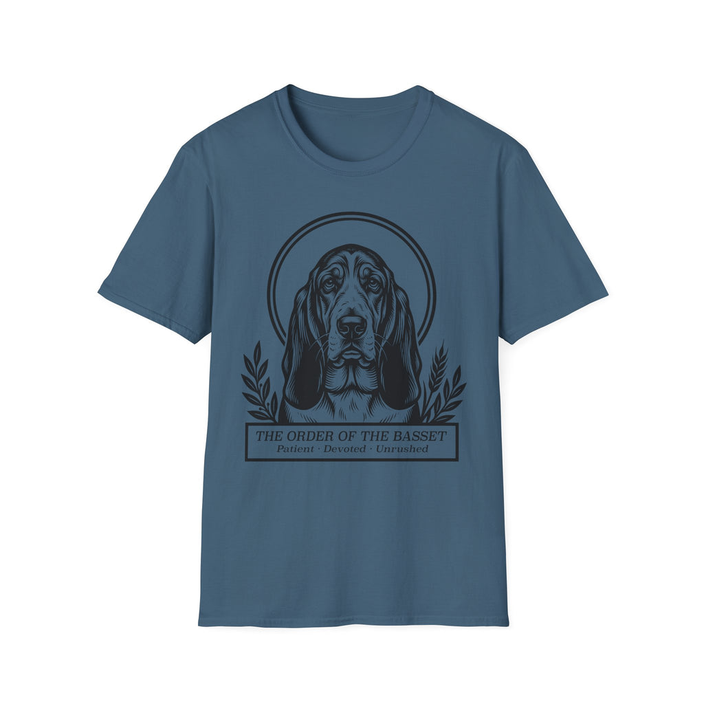 Holy Orders | Basset Hound T-Shirt flat lay on black shirt featuring a stained glass style illustration of a Basset Hound depicted as a holy figure with a golden halo and the text 'Holy Orders.'