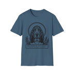 Holy Orders | Basset Hound T-Shirt flat lay on black shirt featuring a stained glass style illustration of a Basset Hound depicted as a holy figure with a golden halo and the text 'Holy Orders.'