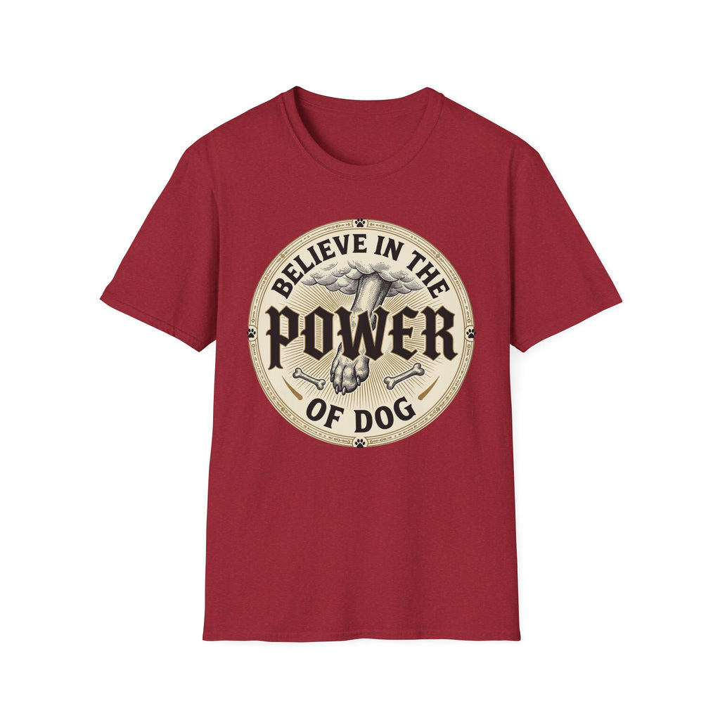Believe in the Power of Dog Paw T-shirt flat lay in cardinal red, featuring a circular vintage badge graphic of a dog paw raised like a fist from clouds above crossed bones, with paw print accents and bold text.