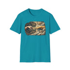 Creation of Adam T-Shirt flat lay in tropical teal, featuring a dog-themed parody of the Michelangelo fresco with a human hand reaching toward a dog's paw, an angel golden retriever and cherub amid baroque golden clouds.