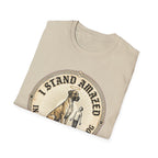I Stand Amazed Great Dane T-Shirt folded view in sand, showing the massive Great Dane with halo graphic and "I Stand Amazed" text on the front.