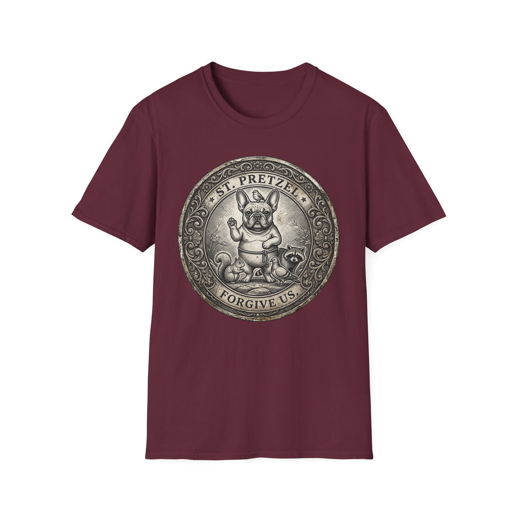 Saint Pretzel Forgive Us T-Shirt flat lay on maroon shirt featuring an engraved medallion design with a French Bulldog saint, a squirrel, and a raccoon, reading St. Pretzel Forgive Us.