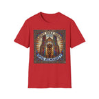 Holy Holy Holy St Bernard T-Shirt flat lay on red, featuring a stained-glass-style illustration of a St Bernard seated before cathedral arches with the text 'Holy Holy Holy Lord Dog Almighty'.