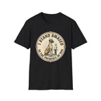 I Stand Amazed Great Dane T-Shirt flat lay in black, featuring a circular vintage-style graphic of a towering Great Dane with a halo and a small human figure, with text "I Stand Amazed in the Presence of Dog."