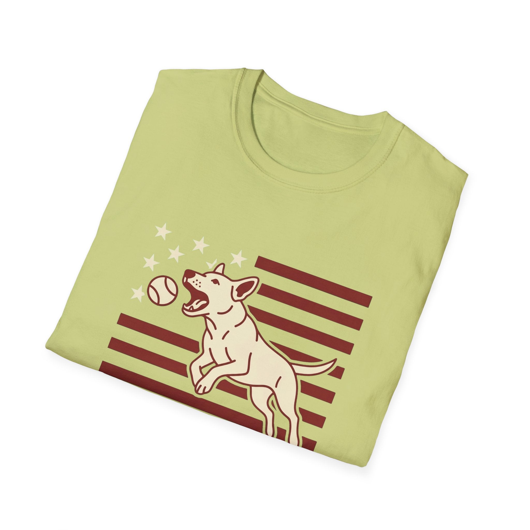 Pursuit of Fetch T-Shirt in light green kiwi, folded view showing the leaping dog catching a tennis ball over a flag of red stripes and stars graphic on the chest.