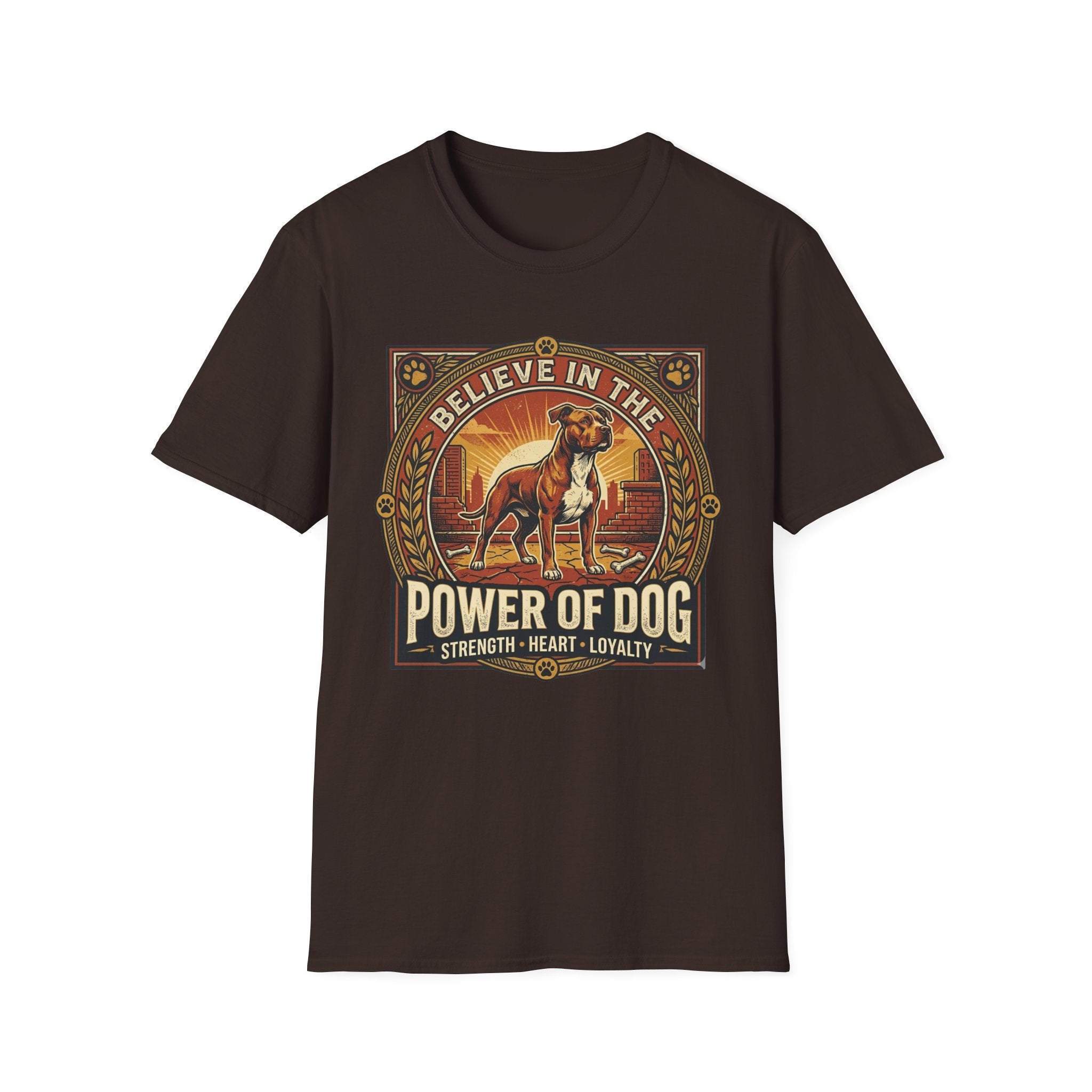 Believe in the Power of Dog Pitbull Cityscape T-Shirt in dark chocolate brown, flat lay, featuring a retro-style badge graphic of a muscular brown and white Pitbull standing proudly before a warm urban cityscape at sunset, with text reading Believe in the Power of Dog and Strength, Heart, Loyalty.