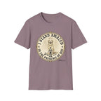 I Stand Amazed Golden Retriever T-Shirt flat lay in dusty mauve purple, featuring a circular vintage-style graphic of a golden retriever with a halo and the text "I Stand Amazed in the Presence of Dog" with Dogma House branding.