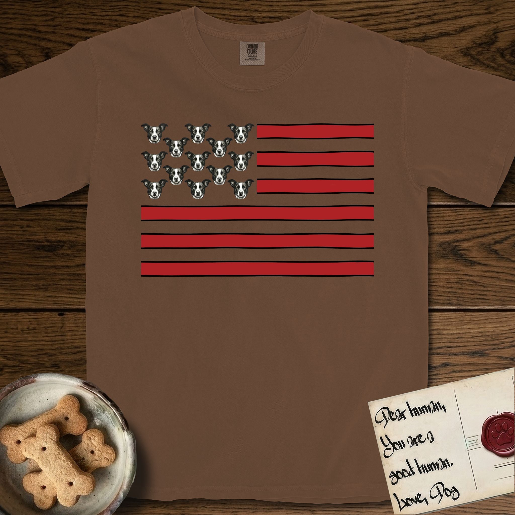 Lobo Head Flag T-Shirt flat lay in Espresso, featuring an American flag with thirteen repeated black-and-white photos of a Pitbull-and-cattle-dog-mix Dog head in place of the stars and dusty red stripes.