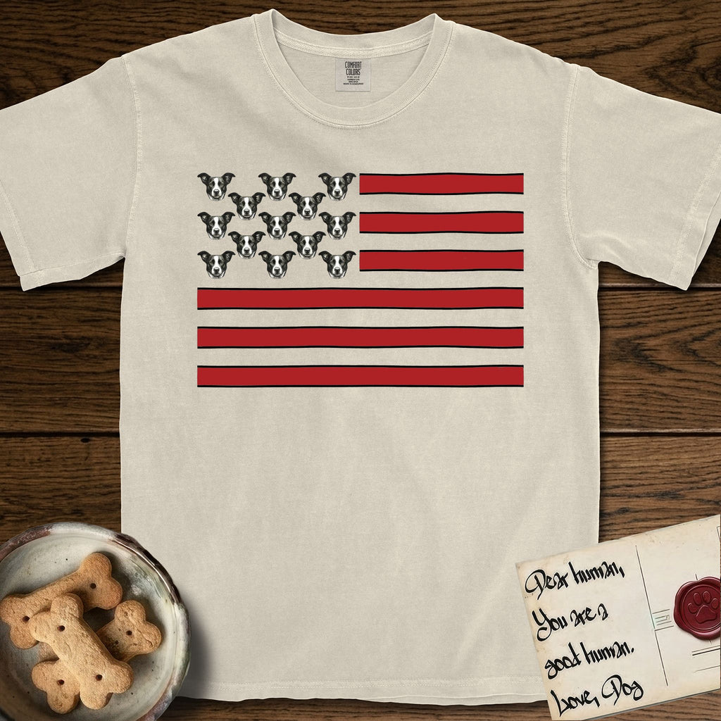 Lobo Head Flag T-Shirt flat lay in Ivory, featuring an American flag with thirteen repeated black-and-white photos of a Pitbull-and-cattle-dog-mix Dog head in place of the stars and dusty red stripes.