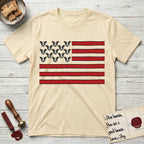 Lobo Head Flag T-Shirt flat lay in Natural, featuring an American flag with thirteen repeated black-and-white photos of a Pitbull-and-cattle-dog-mix Dog head in place of the stars and dusty red stripes.