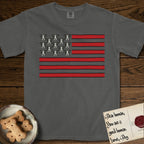 Lobo Head Flag T-Shirt flat lay in Pepper, featuring an American flag with thirteen repeated black-and-white photos of a Pitbull-and-cattle-dog-mix Dog head in place of the stars and dusty red stripes.