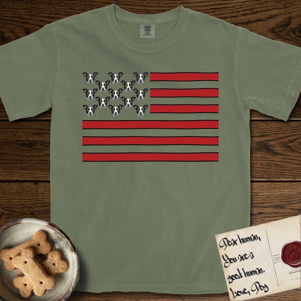 Lobo Head Flag T-Shirt flat lay in Sage, featuring an American flag with thirteen repeated black-and-white photos of a Pitbull-and-cattle-dog-mix Dog head in place of the stars and dusty red stripes.