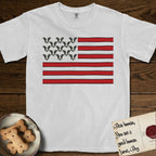 Lobo Head Flag T-Shirt flat lay in White, featuring an American flag with thirteen repeated black-and-white photos of a Pitbull-and-cattle-dog-mix Dog head in place of the stars and dusty red stripes.