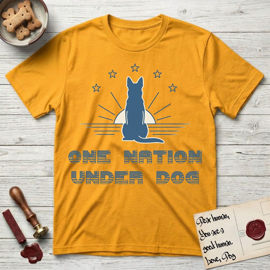 One Nation Under Dog T-Shirt flat lay in Gold, featuring a minimalist design with a Dog silhouette over a radiating sunburst, five stars, and bold "One Nation Under Dog" typography.