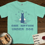 One Nation Under Dog T-Shirt flat lay in Island Reef, featuring a minimalist design with a Dog silhouette over a radiating sunburst, five stars, and bold "One Nation Under Dog" typography.