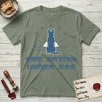 One Nation Under Dog T-Shirt flat lay in Sage, featuring a minimalist design with a Dog silhouette over a radiating sunburst, five stars, and bold "One Nation Under Dog" typography.