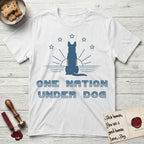 One Nation Under Dog T-Shirt flat lay in White, featuring a minimalist design with a Dog silhouette over a radiating sunburst, five stars, and bold "One Nation Under Dog" typography.