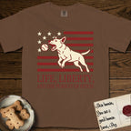 Life, Liberty, and the Pursuit of Fetch T-Shirt flat lay in Espresso, featuring a square flag-inspired design with a Bull Terrier leaping after a ball, cream stars, and bold "Life, Liberty, and the Pursuit of Fetch" serif typography.