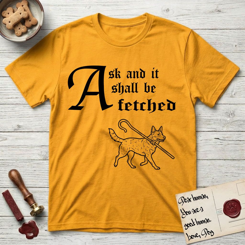 Ask and It Shall Be Fetched Australian Cattle Dog T-Shirt flat lay in Gold, featuring a sparse pen-and-ink illustration of an Australian Cattle Dog at a proud trot carrying a shepherd's crook.