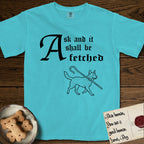 Ask and It Shall Be Fetched Australian Cattle Dog T-Shirt flat lay in Lagoon Blue, featuring a sparse pen-and-ink illustration of an Australian Cattle Dog at a proud trot carrying a shepherd's crook.