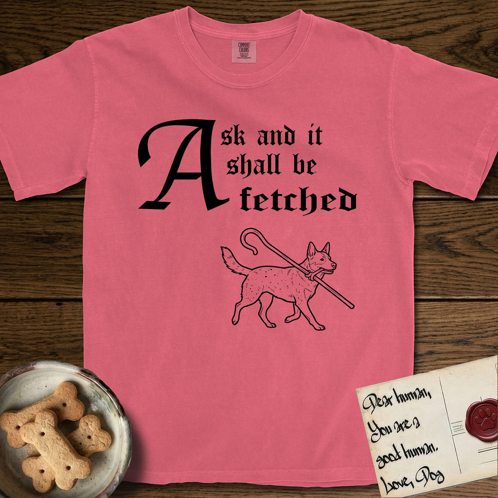 Ask and It Shall Be Fetched Australian Cattle Dog T-Shirt flat lay in Watermelon, featuring a sparse pen-and-ink illustration of an Australian Cattle Dog at a proud trot carrying a shepherd's crook.