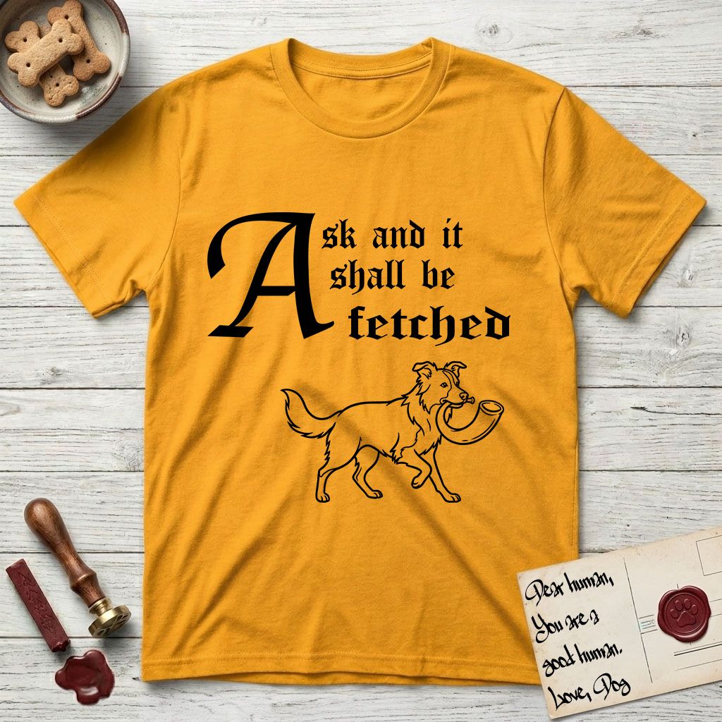 Ask and It Shall Be Fetched Border Collie T-Shirt flat lay in Gold, featuring a sparse pen-and-ink illustration of a Border Collie at a proud trot carrying a shofar.
