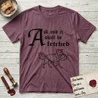 Ask and It Shall Be Fetched Border Collie T-Shirt flat lay in Heather Maroon, featuring a sparse pen-and-ink illustration of a Border Collie at a proud trot carrying a shofar.
