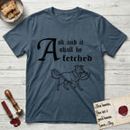Ask and It Shall Be Fetched Border Collie T-Shirt flat lay in Indigo Blue, featuring a sparse pen-and-ink illustration of a Border Collie at a proud trot carrying a shofar.