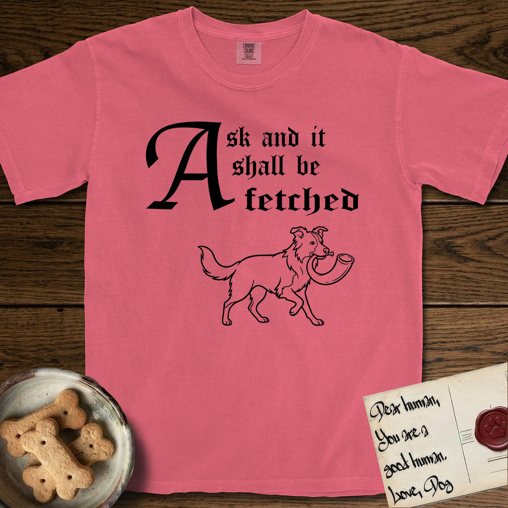 Ask and It Shall Be Fetched Border Collie T-Shirt flat lay in Watermelon, featuring a sparse pen-and-ink illustration of a Border Collie at a proud trot carrying a shofar.